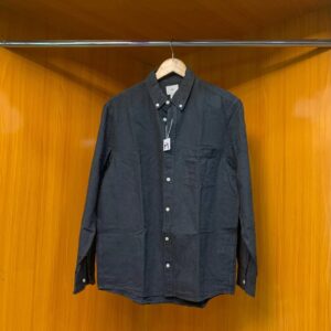 Black long-sleeve button-up shirt with front pockets